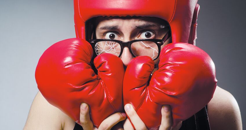 men with boxing clove and broken specs